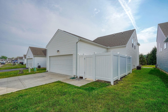 1957 Cumberland St, Newark, OH 43055 - view of property exterior with a cooling unit and an attached garage
