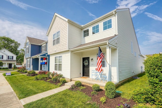 1957 Cumberland St, Newark, OH 43055 - view of front facade featuring a front lawn and covered porch