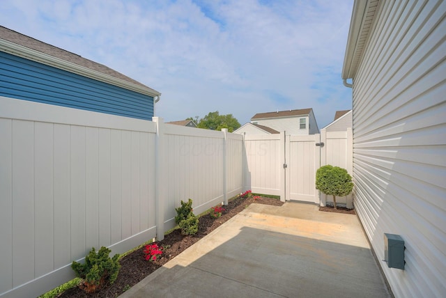 1957 Cumberland St, Newark, OH 43055 - fenced backyard featuring a gate and a patio area