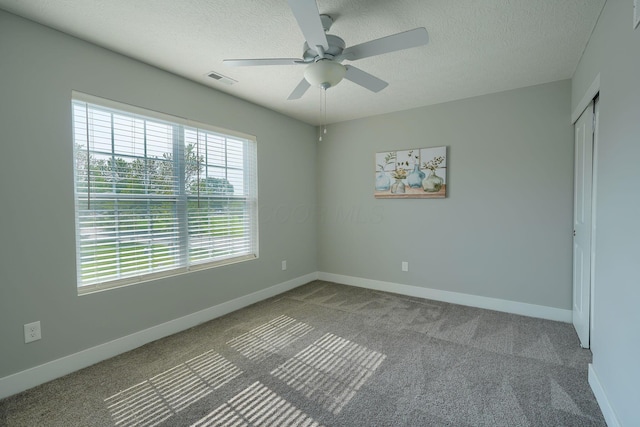 1957 Cumberland St, Newark, OH 43055 - carpeted empty room with ceiling fan and a textured ceiling