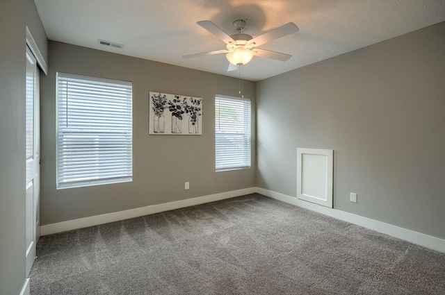 1957 Cumberland St, Newark, OH 43055 - empty room with ceiling fan and carpet flooring