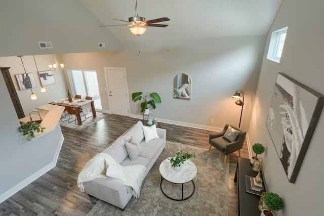 1957 Cumberland St, Newark, OH 43055 - living area featuring high vaulted ceiling, wood finished floors, ceiling fan, and a chandelier