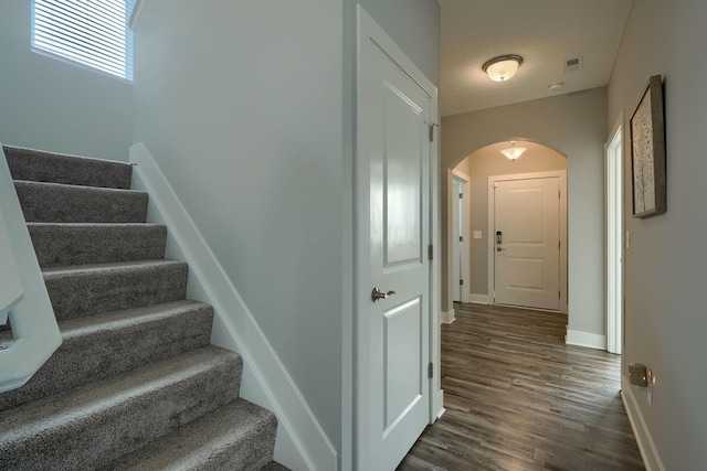 1957 Cumberland St, Newark, OH 43055 - stairs with arched walkways and wood finished floors