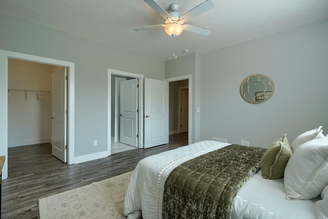 1957 Cumberland St, Newark, OH 43055 - bedroom with wood finished floors, a walk in closet, a ceiling fan, and a closet
