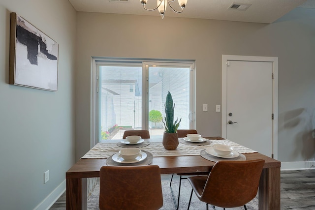 1957 Cumberland St, Newark, OH 43055 - dining room featuring wood finished floors and a chandelier