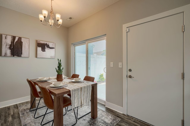 1957 Cumberland St, Newark, OH 43055 - dining room featuring dark wood finished floors and a chandelier