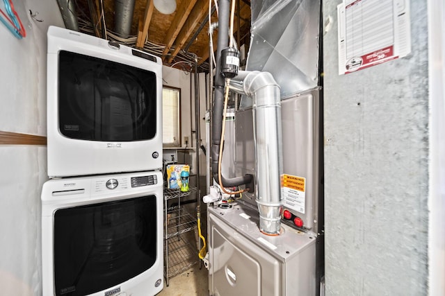 7603 Charlesway Dr Unit 87, Columbus, OH 43085 - laundry area with stacked washer / dryer and heating unit