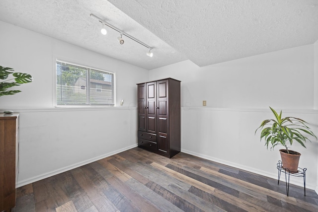 7603 Charlesway Dr Unit 87, Columbus, OH 43085 - unfurnished room with a textured ceiling, wood finished floors, and track lighting