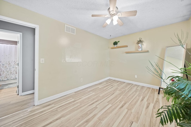 7603 Charlesway Dr Unit 87, Columbus, OH 43085 - spare room featuring light wood finished floors, a textured ceiling, and a ceiling fan