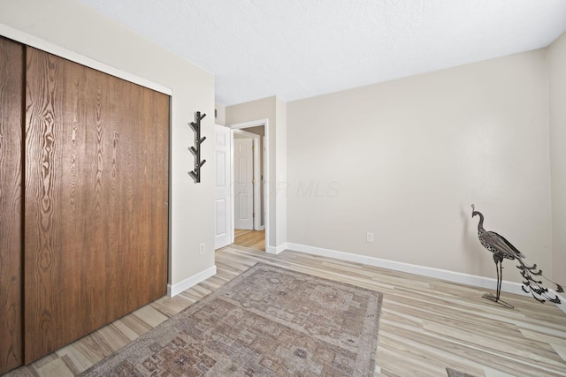7603 Charlesway Dr Unit 87, Columbus, OH 43085 - unfurnished bedroom with light wood finished floors and a closet