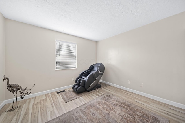 7603 Charlesway Dr Unit 87, Columbus, OH 43085 - unfurnished room featuring wood finished floors and a textured ceiling