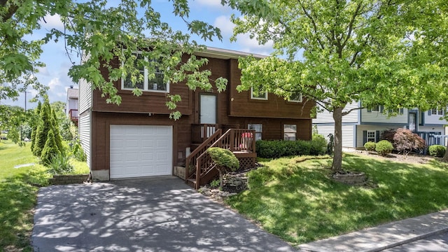 7603 Charlesway Dr Unit 87, Columbus, OH 43085 - raised ranch with an attached garage, driveway, and a front lawn