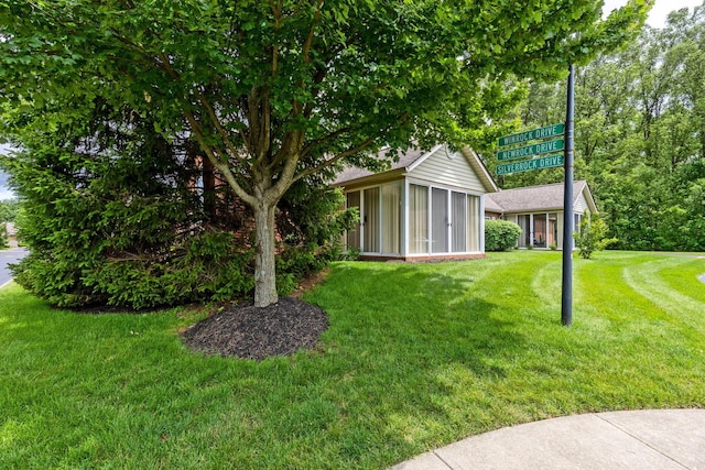 6858 Winrock Dr, New Albany, OH 43054 - view of green lawn with a sunroom