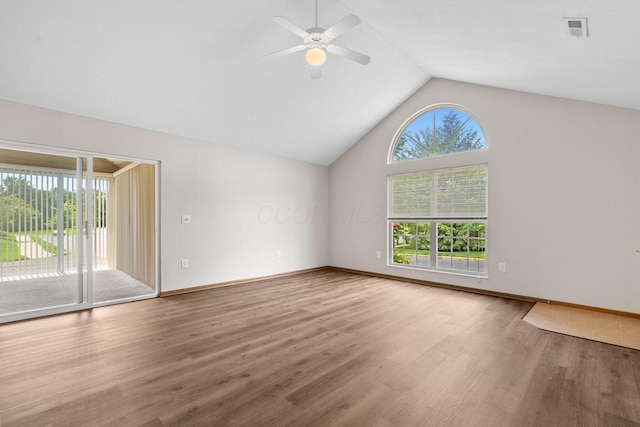 6858 Winrock Dr, New Albany, OH 43054 - empty room featuring ceiling fan, wood finished floors, and vaulted ceiling