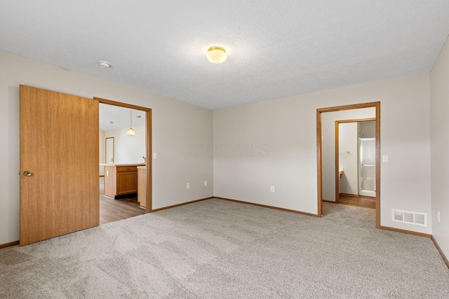6858 Winrock Dr, New Albany, OH 43054 - unfurnished bedroom featuring light colored carpet and ensuite bath