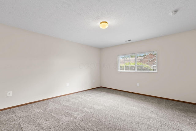6858 Winrock Dr, New Albany, OH 43054 - carpeted spare room with a smoke detector and a textured ceiling