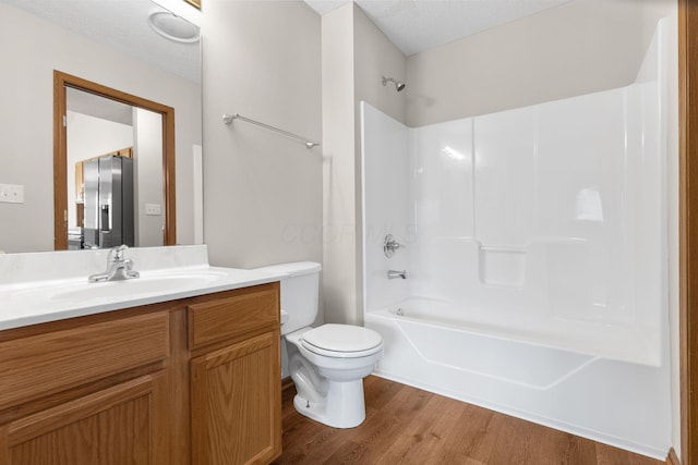 6858 Winrock Dr, New Albany, OH 43054 - bathroom with wood finished floors, vanity, and  shower combination