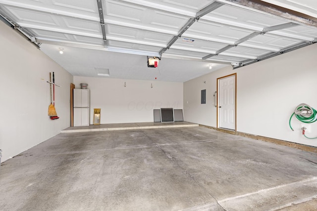 6858 Winrock Dr, New Albany, OH 43054 - garage featuring a garage door opener and electric panel