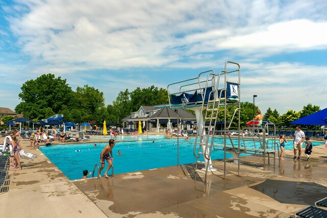 9427 Clermont Cir, Powell, OH 43065 - community pool featuring a water slide