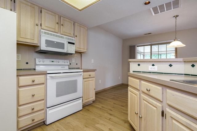 9427 Clermont Cir, Powell, OH 43065 - kitchen featuring white appliances, light brown cabinets, light countertops, and backsplash