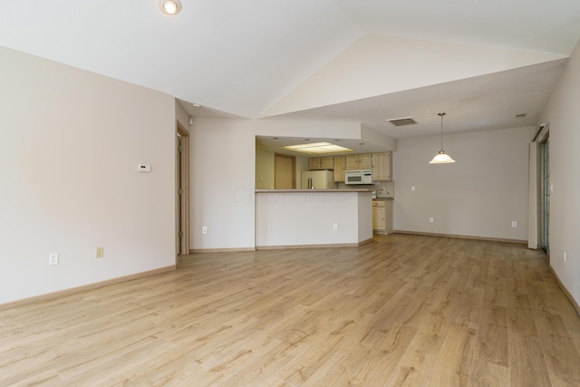 9427 Clermont Cir, Powell, OH 43065 - unfurnished living room with lofted ceiling and light wood finished floors