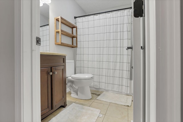 5010 Nelson Dr, South Bloomfield, OH 43103 - full bath featuring tile patterned flooring, vanity, toilet, and curtained shower