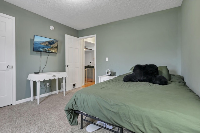 5010 Nelson Dr, South Bloomfield, OH 43103 - bedroom featuring a textured ceiling, light carpet, and baseboards