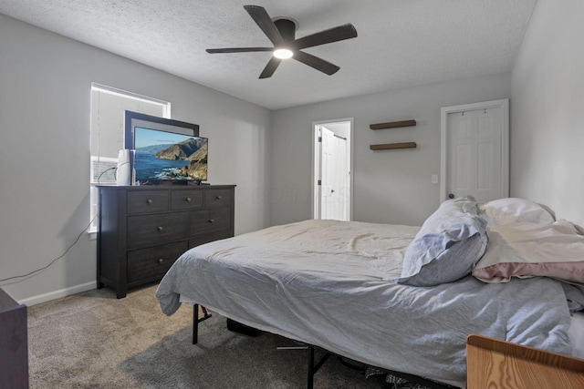 5010 Nelson Dr, South Bloomfield, OH 43103 - bedroom featuring light carpet, baseboards, ceiling fan, and a textured ceiling