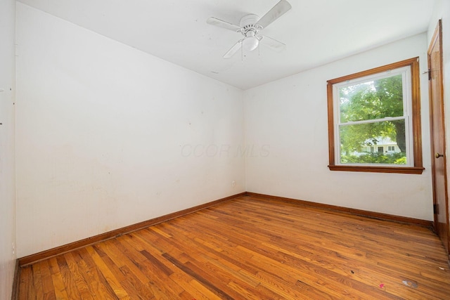 1900 S Champion Ave, Columbus, OH 43207 - empty room featuring hardwood / wood-style floors and ceiling fan