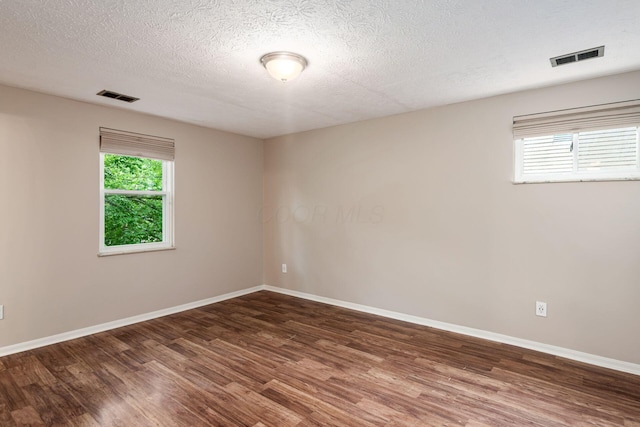 8800 Greenburg Dr, Powell, OH 43065 - unfurnished room featuring wood finished floors, baseboards, and a textured ceiling