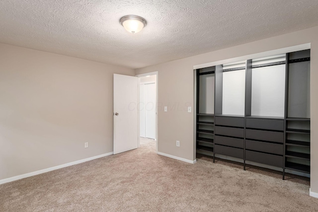 8800 Greenburg Dr, Powell, OH 43065 - unfurnished bedroom featuring carpet, baseboards, a closet, and a textured ceiling