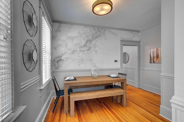 193 E Mithoff St Unit 193, Columbus, OH 43206 - dining space featuring light wood-style flooring and wainscoting