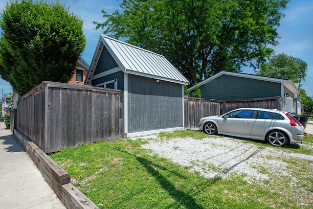193 E Mithoff St Unit 193, Columbus, OH 43206 - view of side of home featuring a metal roof, an outbuilding, and a standing seam roof