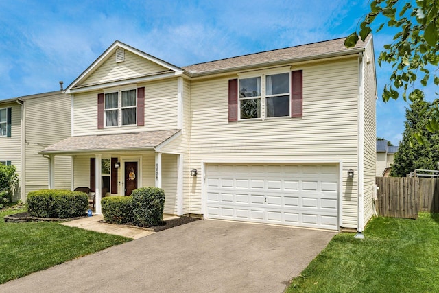 7524 Hemrich Dr, Canal Winchester, OH 43110 - traditional home with asphalt driveway, a garage, and covered porch