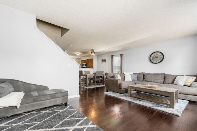 7524 Hemrich Dr, Canal Winchester, OH 43110 - living room featuring wood finished floors and a textured ceiling