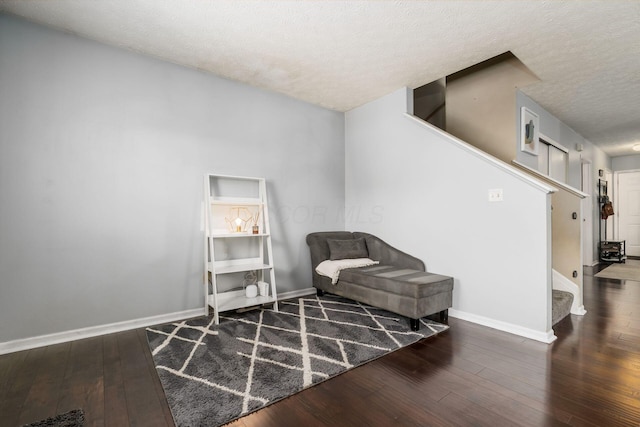 7524 Hemrich Dr, Canal Winchester, OH 43110 - sitting room with stairs, wood-type flooring, and a textured ceiling