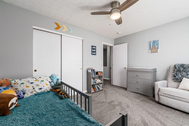 7524 Hemrich Dr, Canal Winchester, OH 43110 - bedroom featuring carpet, a closet, a ceiling fan, and a textured ceiling