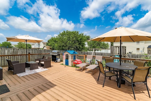 7524 Hemrich Dr, Canal Winchester, OH 43110 - wooden deck featuring a fenced backyard, outdoor dining space, a storage shed, and a grill