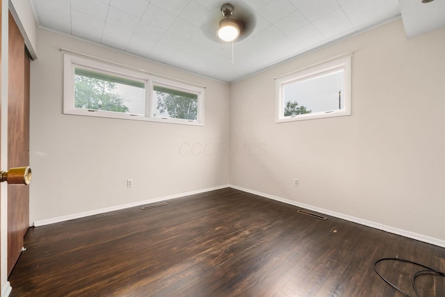 992 S Hague Ave, Columbus, OH 43204 - unfurnished bedroom with baseboards, dark wood-style floors, crown molding, and ceiling fan