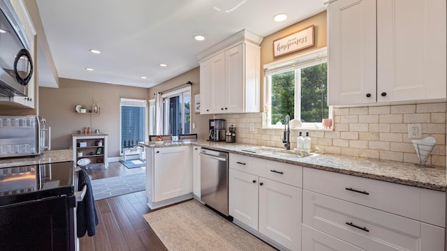 5225 Springdale Blvd, Hilliard, OH 43026 - kitchen featuring stainless steel appliances, dark wood-style floors, white cabinetry, backsplash, and recessed lighting