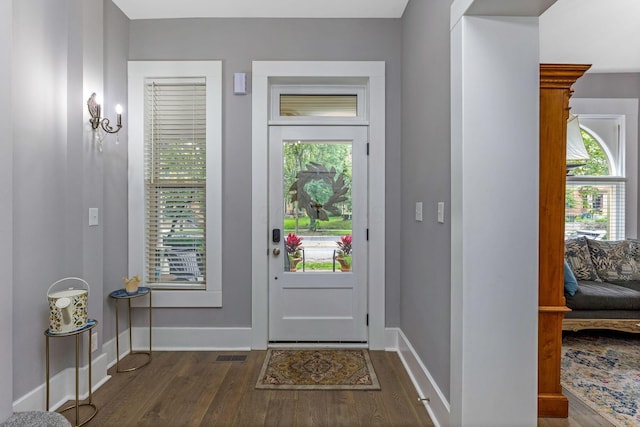 1167 Neil Ave, Columbus, OH 43201 - foyer with dark wood-style floors and baseboards