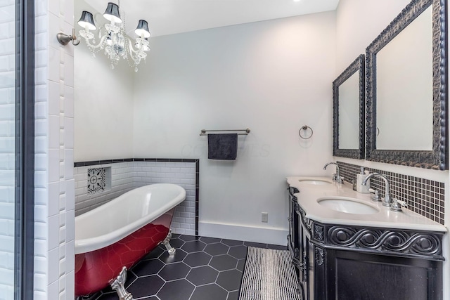 1167 Neil Ave, Columbus, OH 43201 - full bath with a soaking tub, double vanity, tile patterned flooring, and a chandelier