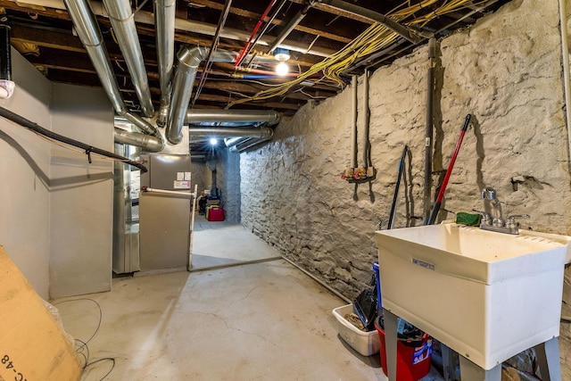 1167 Neil Ave, Columbus, OH 43201 - unfinished basement with a sink and heating unit