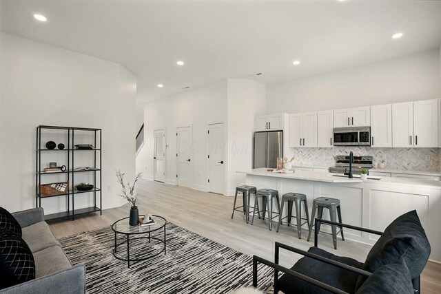 92 E Innis Ave, Columbus, OH 43207 - living area with light wood finished floors and recessed lighting