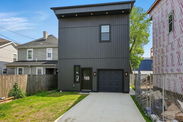 92 E Innis Ave, Columbus, OH 43207 - view of front facade featuring a garage and driveway