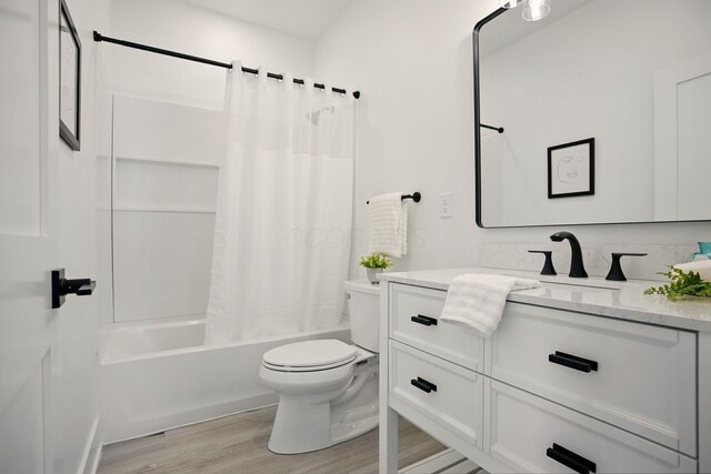 92 E Innis Ave, Columbus, OH 43207 - full bathroom with vanity, shower / bath combo, and wood finished floors