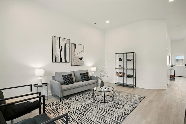 92 E Innis Ave, Columbus, OH 43207 - living area featuring light wood-style flooring, recessed lighting, and a towering ceiling
