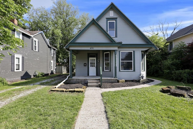 638 E 6th Ave, Lancaster, OH 43130 - bungalow featuring covered porch and a front lawn