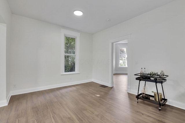 638 E 6th Ave, Lancaster, OH 43130 - empty room with plenty of natural light and wood finished floors
