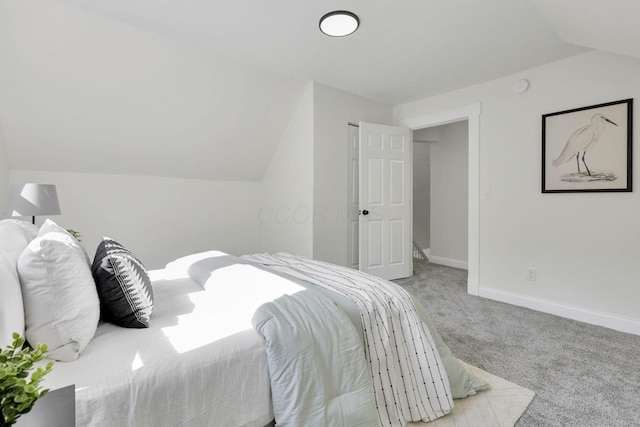 638 E 6th Ave, Lancaster, OH 43130 - carpeted bedroom with vaulted ceiling and baseboards